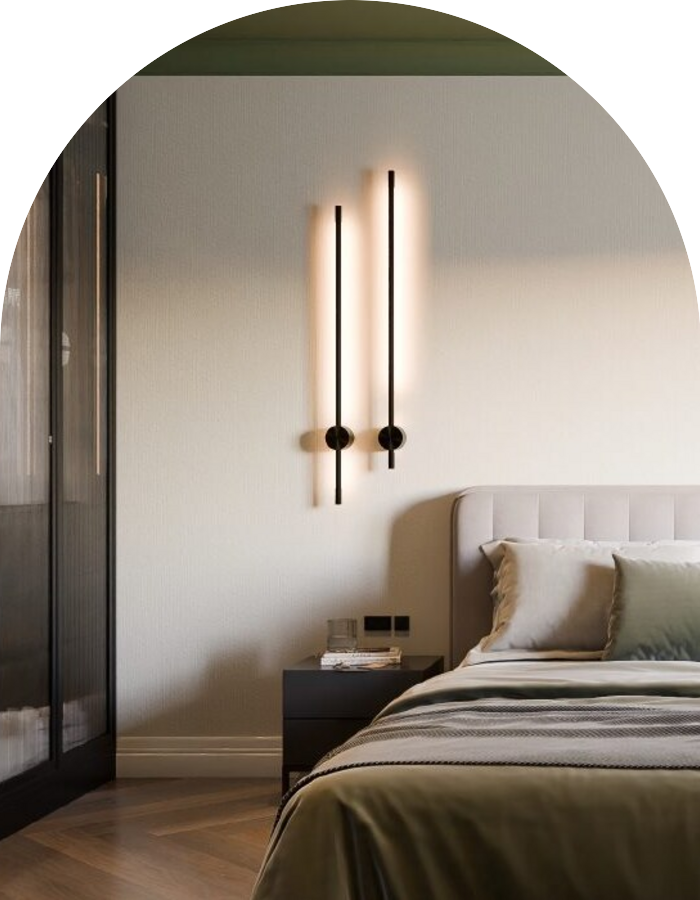 Bedroom interior with vertical wall sconces and olive green bedding