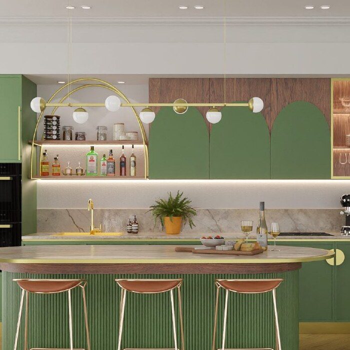 Close-up of a green kitchen island with brass pendant lighting and bar stools